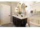 Elegant bathroom features double sinks, granite counters, modern fixtures and stylish mirrors for a spa-like experience at 1127 Lehavre Ct, Hampton, GA 30228