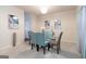 Stylish dining room with a glass table, seating for six, and elegant decor at 1127 Lehavre Ct, Hampton, GA 30228
