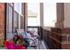 Cozy front porch featuring comfortable seating with floral cushions and warm accents at 1127 Lehavre Ct, Hampton, GA 30228