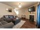 Comfortable living room with stylish furnishings, a fireplace, and a cozy atmosphere at 1127 Lehavre Ct, Hampton, GA 30228