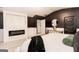 Stunning main bedroom with sleek dark walls, plush bed, designer rug, and ample natural light from large windows at 1127 Lehavre Ct, Hampton, GA 30228