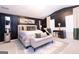 Stunning main bedroom with sleek dark walls, plush bed, designer rug, and ample natural light from large windows at 1127 Lehavre Ct, Hampton, GA 30228