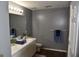 Bathroom featuring a double sink vanity and luxury vinyl floors at 332 Black Willow Ct, Locust Grove, GA 30248