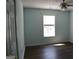 Bright bedroom featuring luxury vinyl floors and a ceiling fan at 332 Black Willow Ct, Locust Grove, GA 30248
