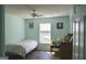 Bedroom featuring luxury vinyl floors, a ceiling fan and light blue walls at 332 Black Willow Ct, Locust Grove, GA 30248