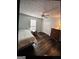 Well-lit bedroom featuring luxury vinyl floors and a ceiling fan at 332 Black Willow Ct, Locust Grove, GA 30248