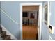 Inviting view into the open living area, featuring a hardwood floor, TV, and tasteful decorations at 332 Black Willow Ct, Locust Grove, GA 30248