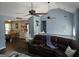 Large Gathering room with vaulted ceilings, fan and open staircase at 332 Black Willow Ct, Locust Grove, GA 30248