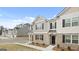 Beautifully designed townhomes with stone and siding accents, and inviting front entrances at 460 Reflection Dr # 21, Stockbridge, GA 30281