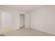 Neutral carpeted bedroom with closet and white walls and doors at 464 Reflection Dr # 22, Stockbridge, GA 30281