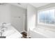 Bathroom featuring a soaking tub, separate shower, and double sink vanity at 75 Heatherstone Way, Covington, GA 30016