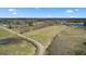 Aerial view of the property showing the home's expansive acreage and beautiful landscape at 2940 E Lake Rd, Mcdonough, GA 30252