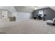 Bonus Room featuring light grey walls, plush carpet, and a ceiling fan with overhead lighting at 2940 E Lake Road, Mcdonough, GA 30252