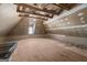 Unfinished attic space shows exposed beams and plywood subfloor with potential for customization at 3860 Bays Ferry Trl, Marietta, GA 30062