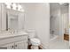 Bright bathroom featuring white fixtures, a vanity, and a toilet at 3860 Bays Ferry Trl, Marietta, GA 30062