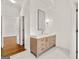 Bright bathroom featuring a modern vanity with a sleek mirror and stylish lighting at 3860 Bays Ferry Trl, Marietta, GA 30062