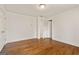 Spacious bedroom featuring hardwood floors and a double-door closet at 3860 Bays Ferry Trl, Marietta, GA 30062