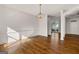 Dining room with hardwood floors, view of the neighbor's house from a window, and a chandelier at 3860 Bays Ferry Trl, Marietta, GA 30062