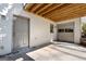 Side entrance with a gray entry door and an attached garage providing convenient access and parking at 3860 Bays Ferry Trl, Marietta, GA 30062
