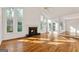 Bright living room with hardwood floors, fireplace, ceiling fan, and large windows at 3860 Bays Ferry Trl, Marietta, GA 30062