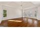 Expansive main bedroom with tray ceiling, hardwood floors, and plenty of natural light from large windows at 3860 Bays Ferry Trl, Marietta, GA 30062