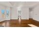 Spacious main bedroom with hardwood floors, large windows, and an en-suite bathroom entrance at 3860 Bays Ferry Trl, Marietta, GA 30062