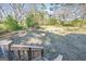 Large backyard with mature trees, a small playhouse, and a view from the deck stairs at 3006 Deshong Dr, Stone Mountain, GA 30087