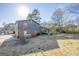 Spacious backyard with a house and wooden deck ideal for outdoor living and entertaining at 3006 Deshong Dr, Stone Mountain, GA 30087