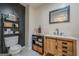 Stylish bathroom with modern fixtures, black accent wall, and decorative shelving at 3006 Deshong Dr, Stone Mountain, GA 30087