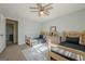 Charming bedroom featuring two twin beds, stylish decor, and a ceiling fan for added comfort at 3006 Deshong Dr, Stone Mountain, GA 30087