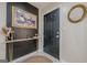 Stylish entryway featuring a modern black door, a unique console table, and elegant decor at 3006 Deshong Dr, Stone Mountain, GA 30087