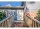 Inviting entryway featuring brick steps, wooden railings, and a bright white front door at 3006 Deshong Dr, Stone Mountain, GA 30087