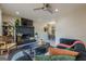 Inviting living room with a striking black brick fireplace, modern furnishings, and stylish decor at 3006 Deshong Dr, Stone Mountain, GA 30087