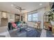 Bright living room boasts a comfy sofa, stylish decor, and a large window with natural light at 3006 Deshong Dr, Stone Mountain, GA 30087