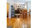 This dining area showcases wood floors and seamlessly connects to a living room with a fireplace at 9989 Village South Dr, Douglasville, GA 30135