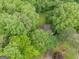 Aerial view of a house surrounded by vibrant trees at 1972 Cox Dr, Austell, GA 30168