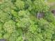 House with a creek in its heavily wooded back yard at 1972 Cox Dr, Austell, GA 30168