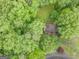 Aerial view of a home amidst a dense, verdant forest canopy at 1972 Cox Dr, Austell, GA 30168