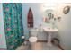 Whimsical bathroom featuring tiled flooring, a pedestal sink, and boat-shaped shelving at 1972 Cox Dr, Austell, GA 30168