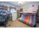 Bedroom featuring carpeted floors, a bunk bed with a futon on the bottom, and a large window at 1972 Cox Dr, Austell, GA 30168