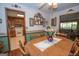 Cozy dining area shows open layout into the kitchen and living area, with wood table at 1972 Cox Dr, Austell, GA 30168
