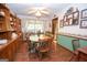 Inviting dining room featuring hardwood floors, wainscoting, a wooden table and vintage hutch at 1972 Cox Dr, Austell, GA 30168