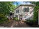 Two-story home with charming covered porch and well-maintained landscaping at 1972 Cox Dr, Austell, GA 30168