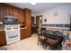 Functional kitchen with white appliances, tiled floors, and cozy breakfast nook at 1972 Cox Dr, Austell, GA 30168