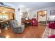 Bright living room with hardwood floors, fireplace and entryway with charming decor at 1972 Cox Dr, Austell, GA 30168