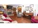 Comfortable living room with brick fireplace, hardwood floors, and a classic piano at 1972 Cox Dr, Austell, GA 30168