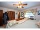 Comfortable main bedroom features a ceiling fan, window, and a spacious closet at 1972 Cox Dr, Austell, GA 30168