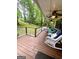 Inviting covered porch with comfortable seating, overlooking a lush green yard at 1972 Cox Dr, Austell, GA 30168