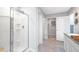 Bathroom featuring a walk-in shower, storage space, and a vanity at 201 Friendship Oak Way, Hampton, GA 30228