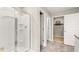 Bright bathroom featuring a large shower with glass doors and tile flooring at 201 Friendship Oak Way, Hampton, GA 30228